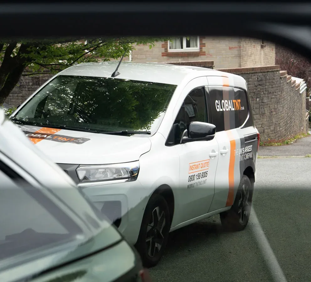 A Global Tint van on a customer’s driveway