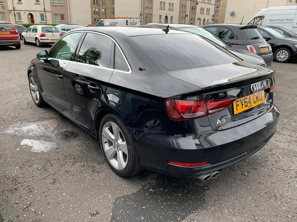Black Audi A3 with dark rear side windows and rear windscreen, viewed from the rear quarter.