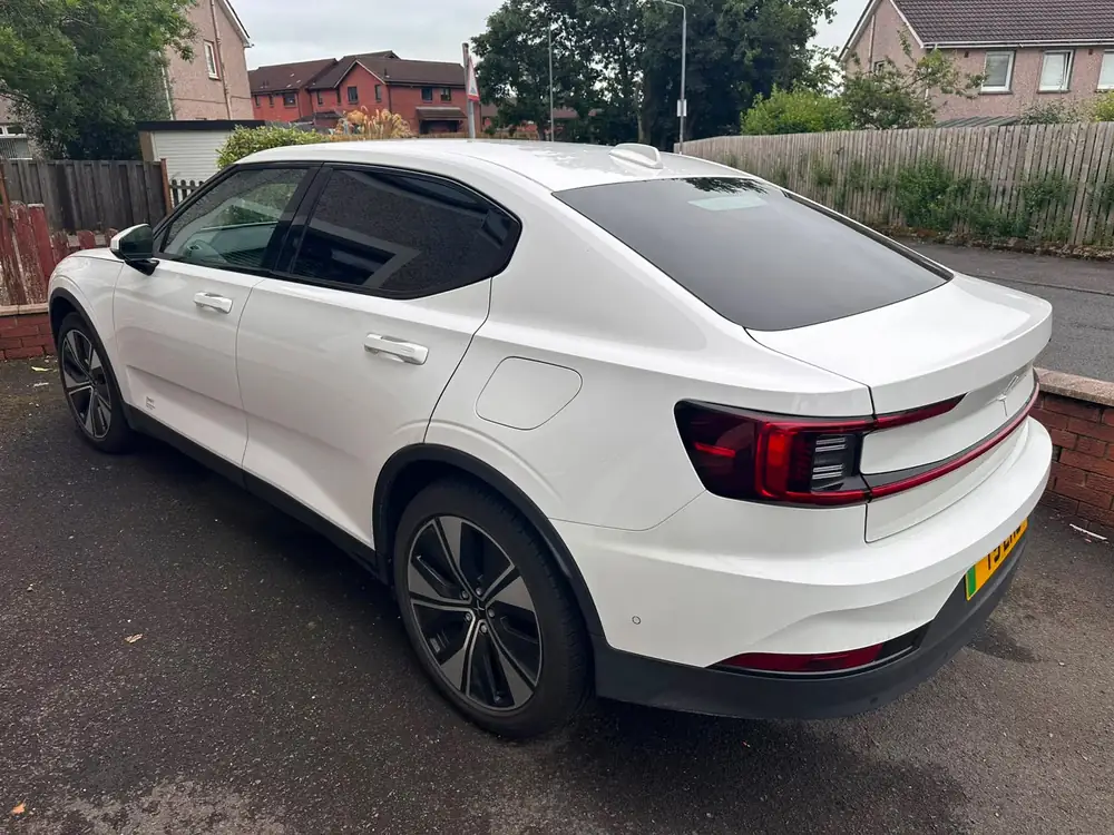 White hatchback with dark rear side windows and rear windscreen, parked on a driveway