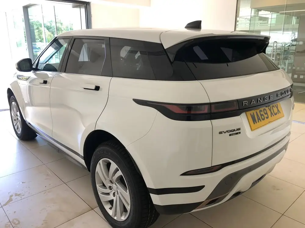 White Range Rover Evoque with a dark rear windscreen, parked indoors on a tiled floor