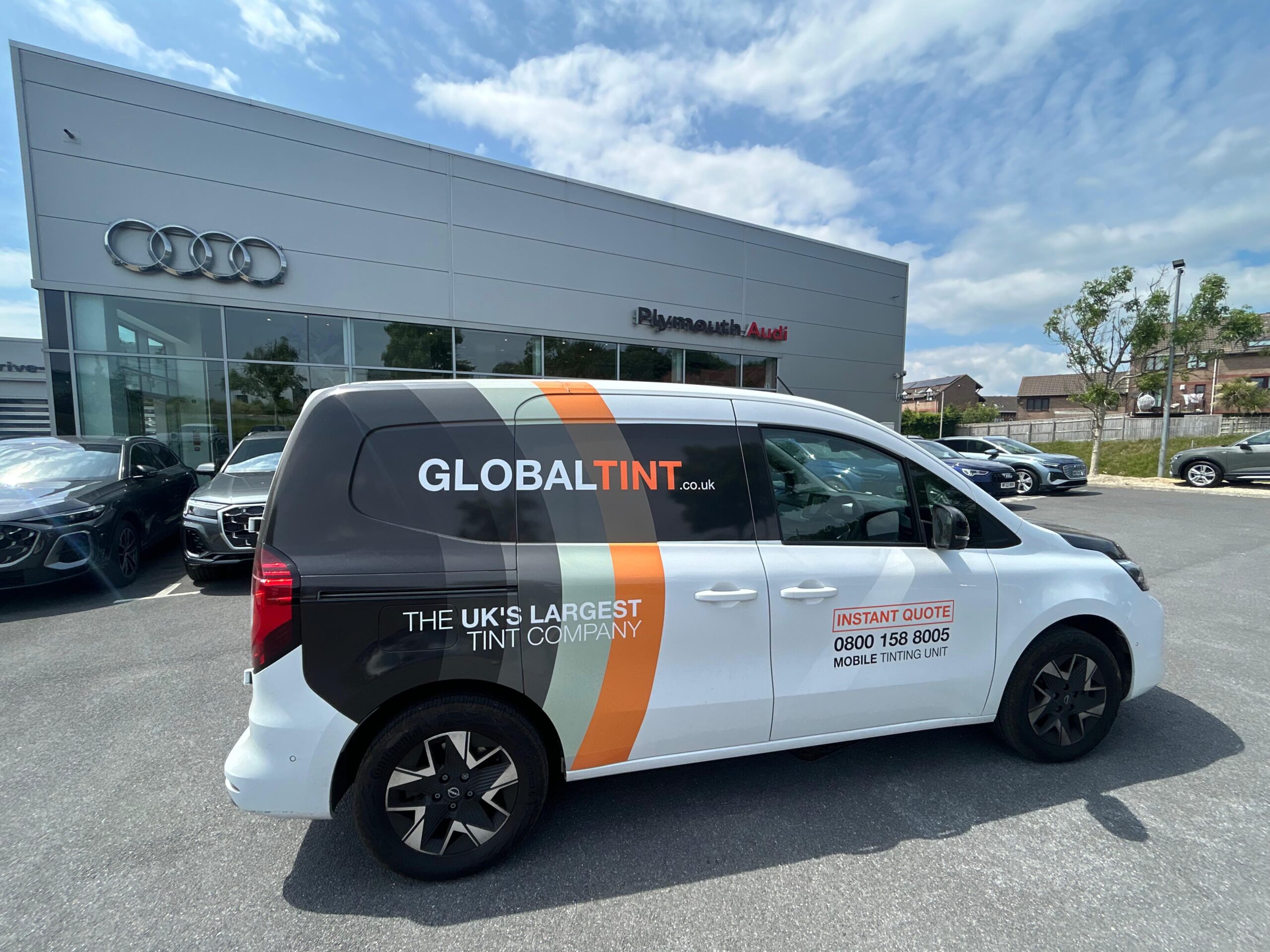A Global Tint van at a Plymouth Audi dealership