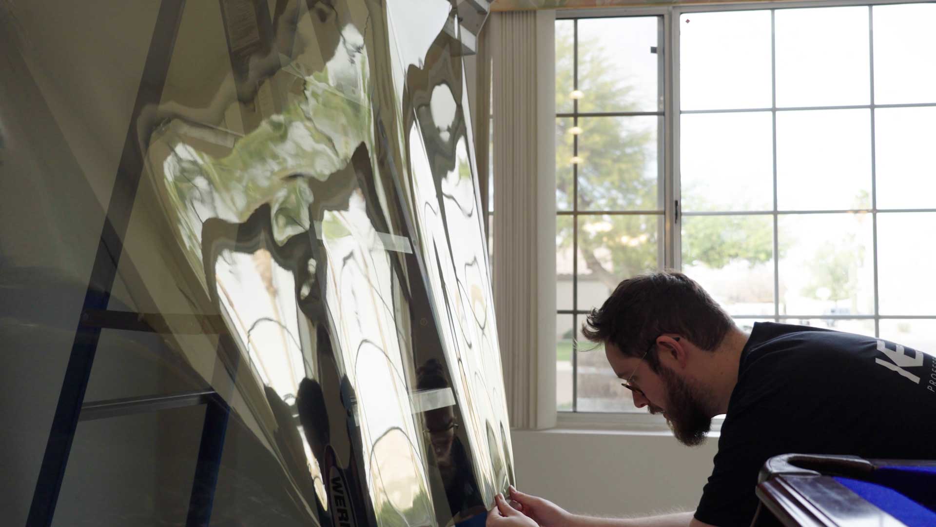 A Global Tint installer at work