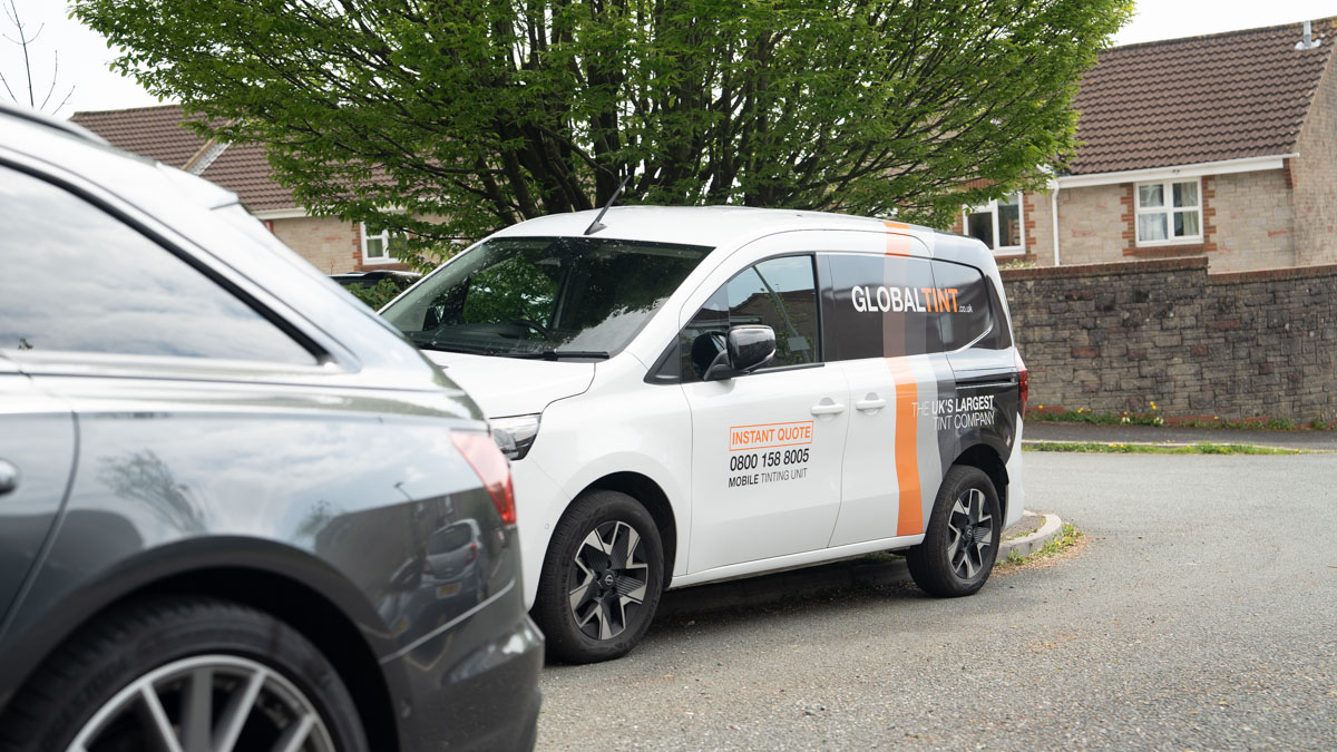 A Global Tint installer at work