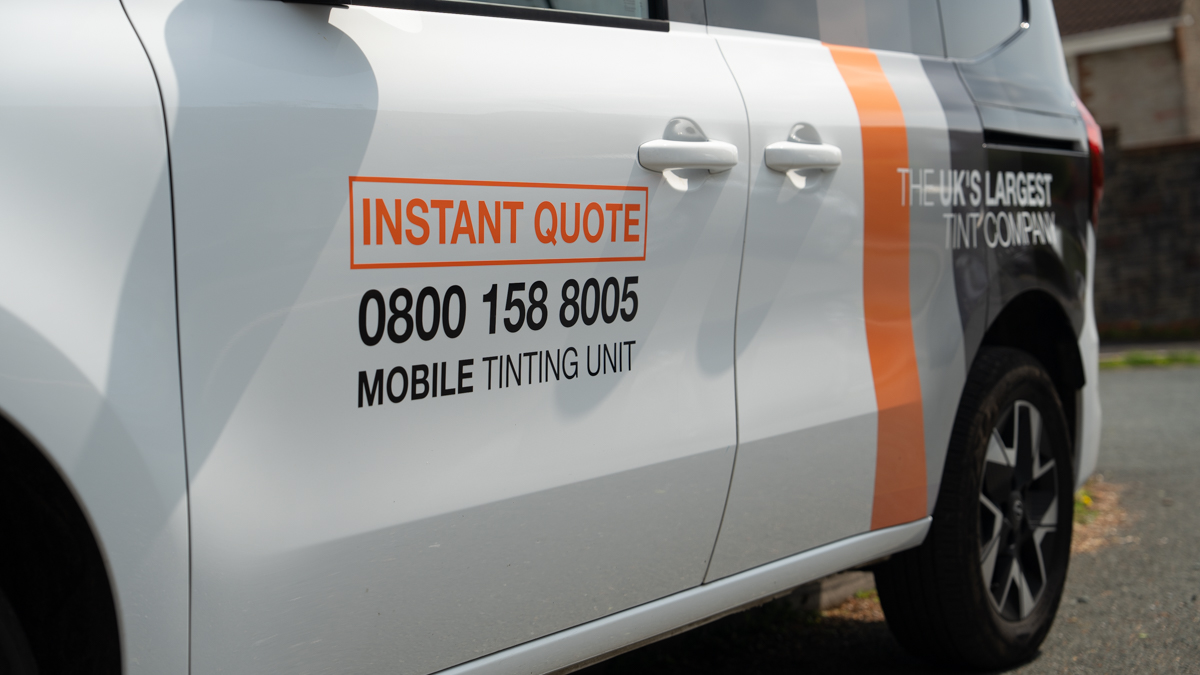 A Global Tint installer at work