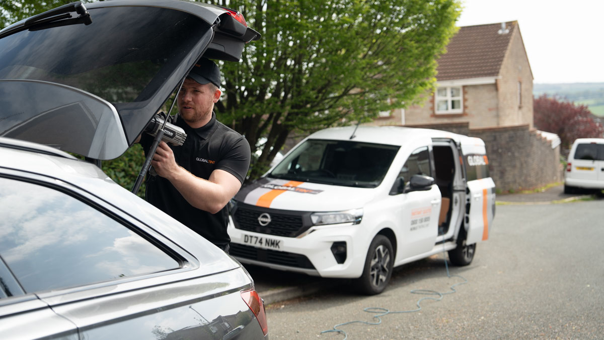 A Global Tint installer at work