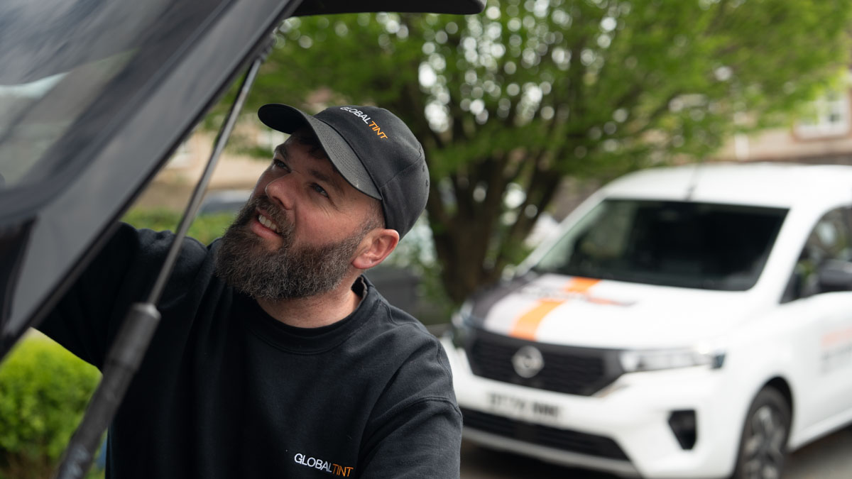 A Global Tint installer at work