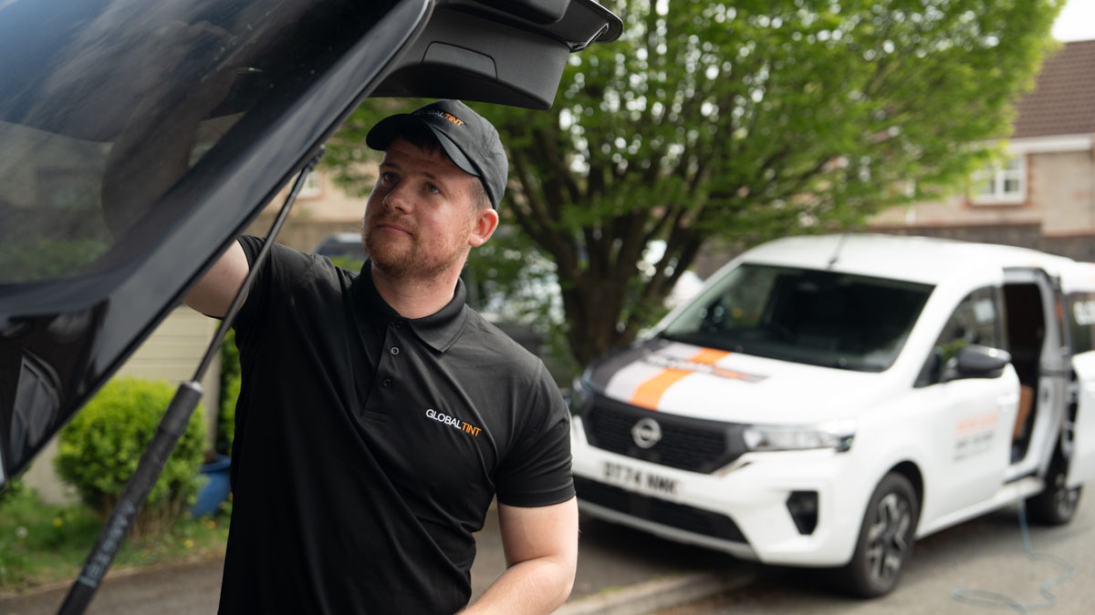 A Global Tint installer at work