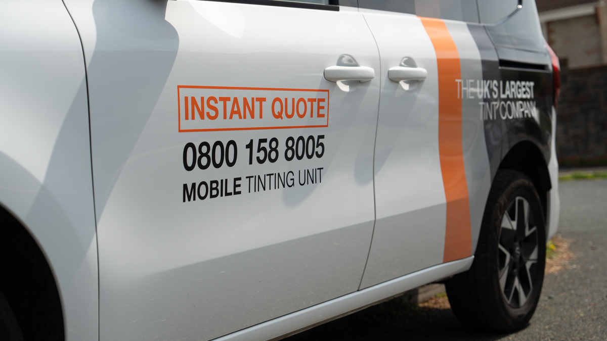 A Global Tint installer at work