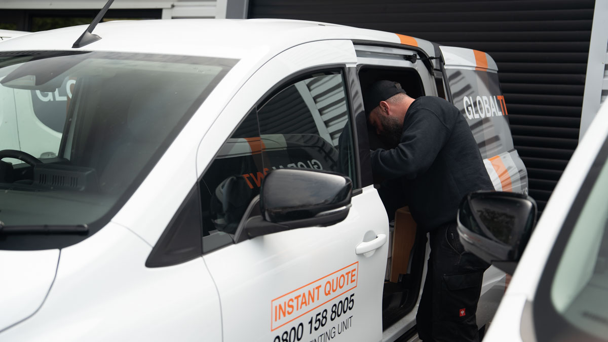 A Global Tint installer at work