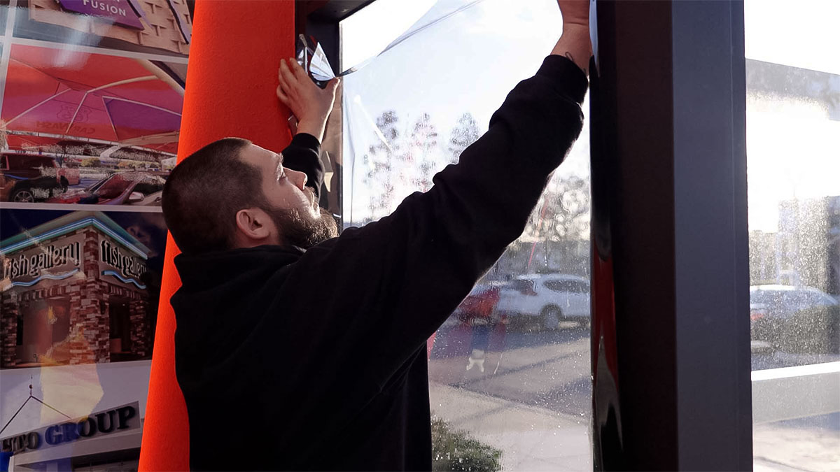 A Global Tint installer at work