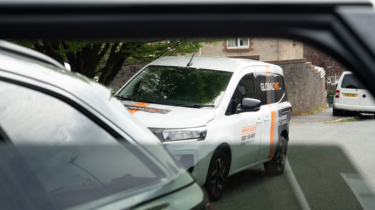 A Global Tint installer at work