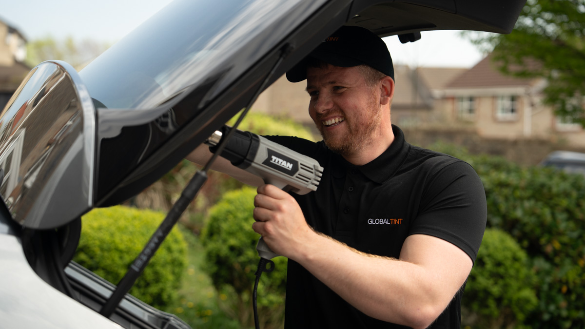 A Global Tint installer at work