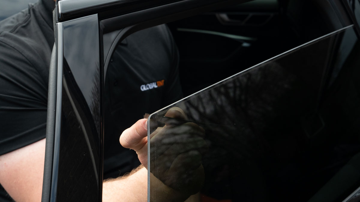 A Global Tint installer at work