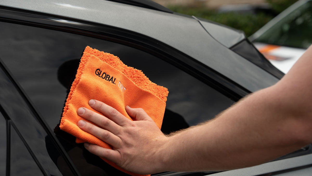 A Global Tint installer at work