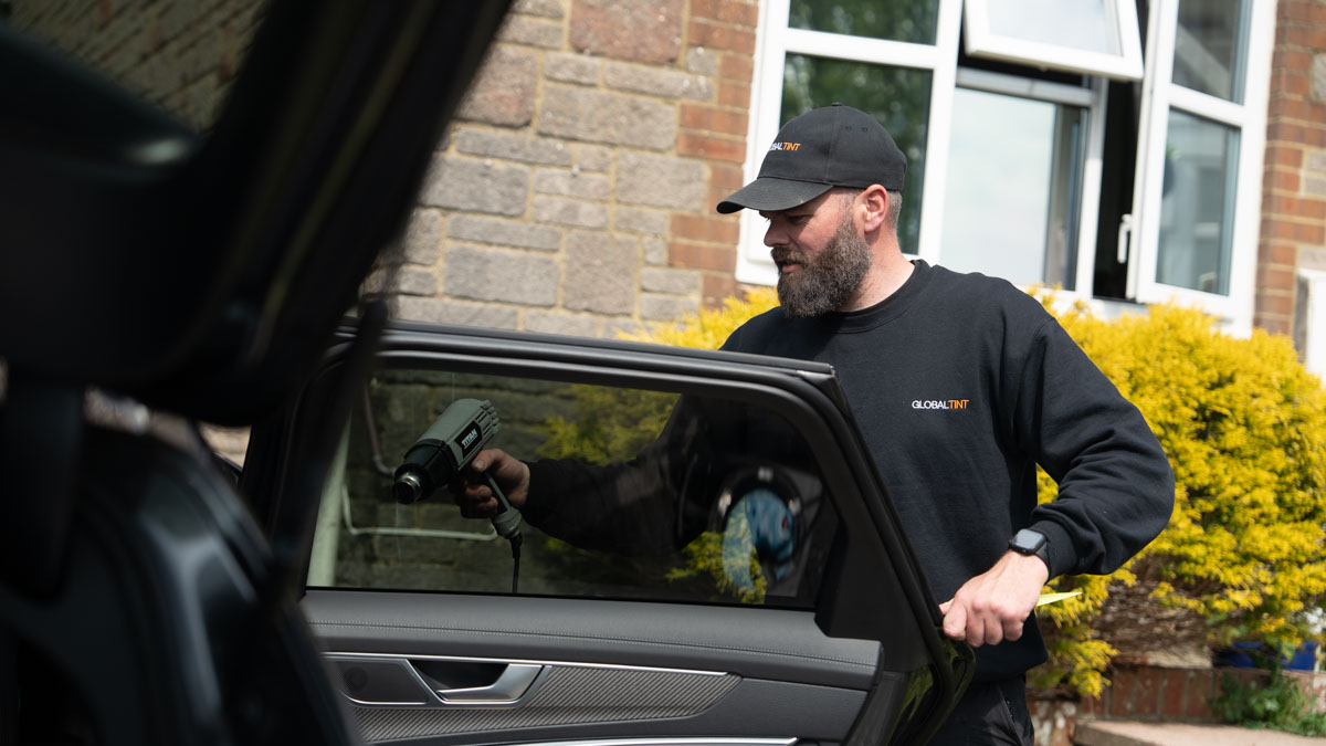 A Global Tint installer at work